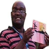 A smiling bald person wearing glasses and a black and red striped shirt, and holding a small painting.